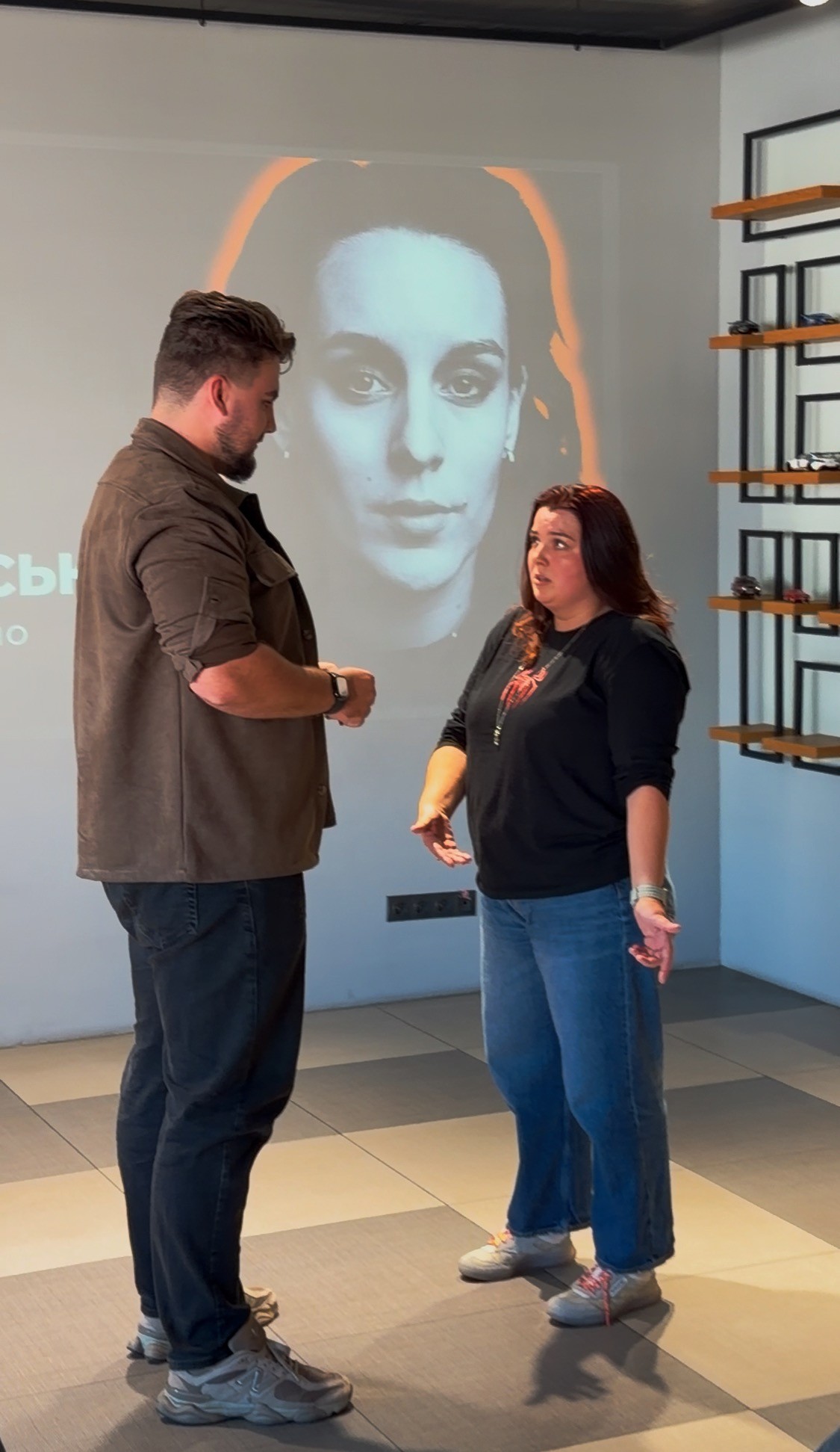 A man and a woman are standing face to face, shouting at each other and waving their arms